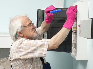 Man fixing electric light meter