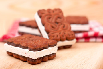 coockies with zephyr layer on wooden background