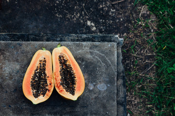 Cut up papaya fruit in the garden