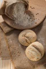 white bread and flour on the table