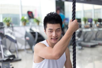 Plakat young man working out in modern gym