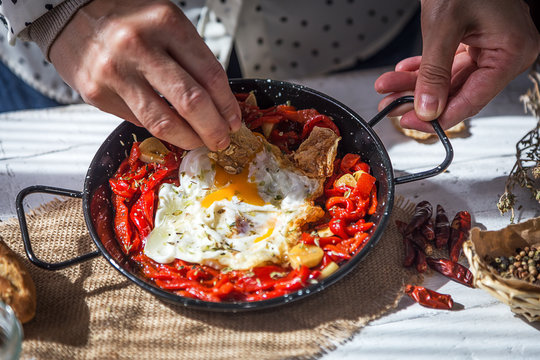 Delicious fried eggs with red peppers