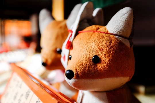 Two fox dolls with masks at Fushimi Inari shrine in Kyoto, Japan. Stock  Photo | Adobe Stock