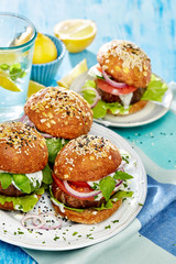 Baked portobello mushroom burger with addition fresh lettuce, tomato, onion and herb yogurt dip. Delicious and nutritious vegetarian dish
