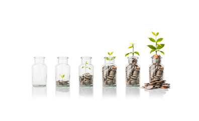 Glass jars with coins, savings concept