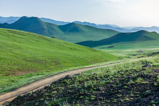 Winding dirt road, central Mongolian steppe