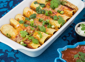 Casserole dish with mexican food - beef enchiladas.