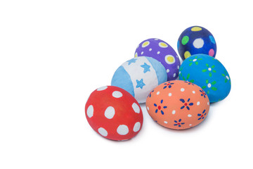 Pile of colorful handmade easter eggs isolated on white