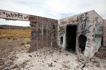 A remote and abandoned gas station crumbles in the Utah desert.
