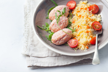 Crab and prawn, fish steamed meatballs, patties with couscous on white background Top view