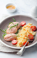 Crab and prawn, fish steamed meatballs, patties with couscous on white background Top view