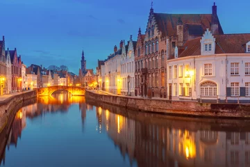 Fototapeten Scenic night cityscape with views of Spiegelrei and Jan van Eyckplein in Bruges, Belgium © Kavalenkava