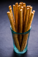 Bread sticks with salt in glass jar