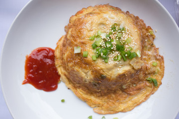 fried egg omelette with scallion and white sesame ready to serve on dish.