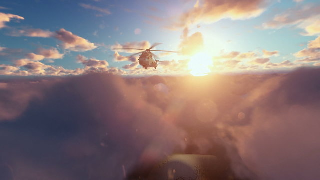 Military Helicopter above clouds at sunrise