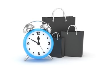 alarm clock and shopping bag (time to buy concept)
