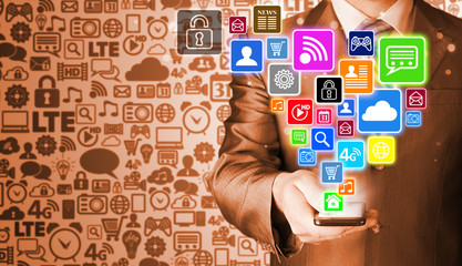 Business man using smart phone with social media icon set