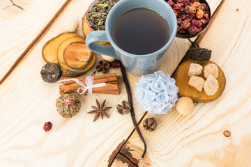 Tea cups with teapot on old wooden table