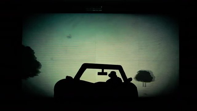 Silhouette of the Car Out of the Shadows People