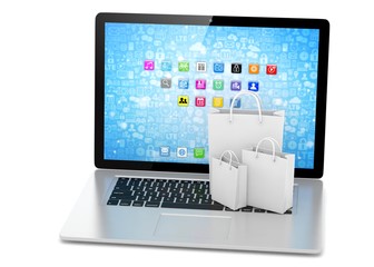 laptop and  shopping pags on white background