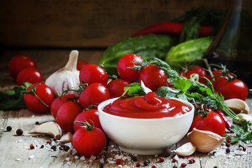 Tomato ketchup sauce with garlic, spices and herbs with cherry t