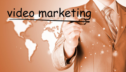business man writing Video Marketing