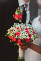 Beatiful bride with boquet in the hend