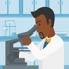 Laboratory assistant with microscope.