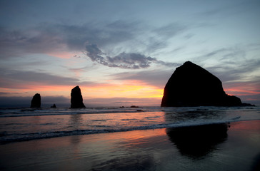 A brilliant sky creates the backdrop for the imposing Haystack Rock in the Pacific Ocean off Cannon Beach on Oregon&rsquo;s northern coastline.