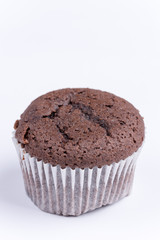 Macro view of chocolate muffin over white