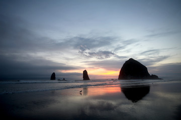 A brilliant sky creates the backdrop for the imposing Haystack Rock in the Pacific Ocean off Cannon Beach on Oregon&rsquo;s northern coastline.