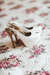 Beautiful bride's white shoes