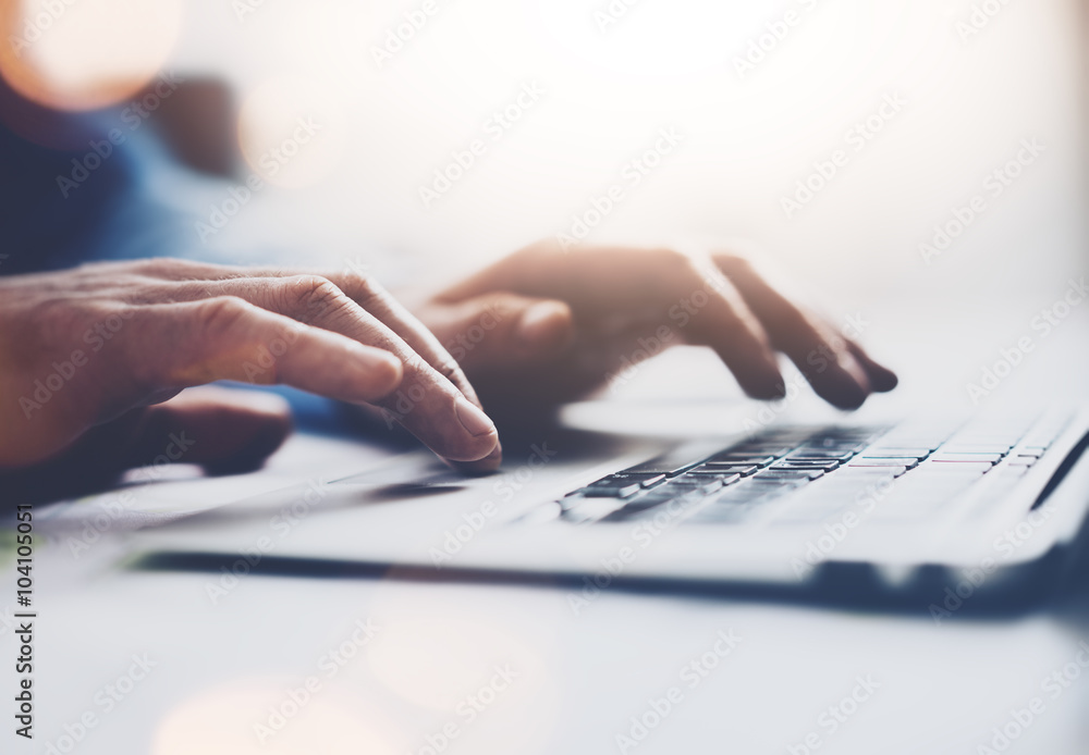 Wall mural photo businessman working with generic design notebook. typing message, hands keyboard. blurred back