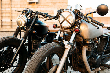Naklejka premium Two black and silver vintage custom motorcycles cafe racers