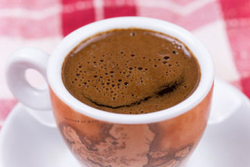 Close macro view of cup of coffee ballons
