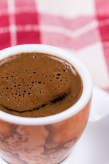 Close macro view of cup of coffee ballons