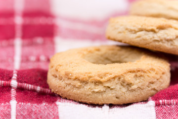 Macro view of round tea cookies on the tablecloth