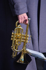 Cornet in the hand of bandsman.