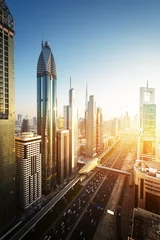 Foto op Plexiglas De skyline van Dubai in zonsondergangtijd, Verenigde Arabische Emiraten © Iakov Kalinin
