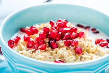 Fresh summer breakfast, cereals with pomegranate.