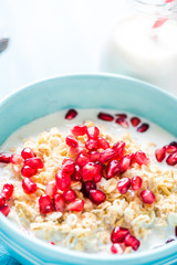 Fresh summer breakfast, cereals with pomegranate.