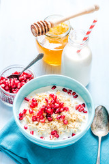 Fresh summer breakfast, cereals with pomegranate.