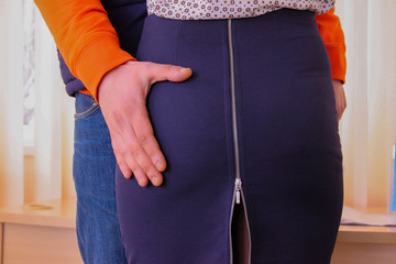 hand on a blue skirt