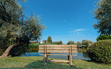 bench at the waterside of the pond