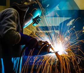 welding worker in the automotive part in Industrial
