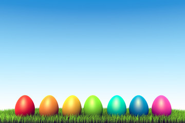 Color eggs row in the green grass Easter background.