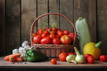 Fototapeta na wymiar Fresh vegetables in basket on wooden table.