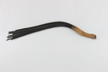 flogger with carved wooden handle