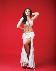 Beautiful belly dancer in the studio