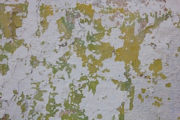 Peeling old paint on the wall 